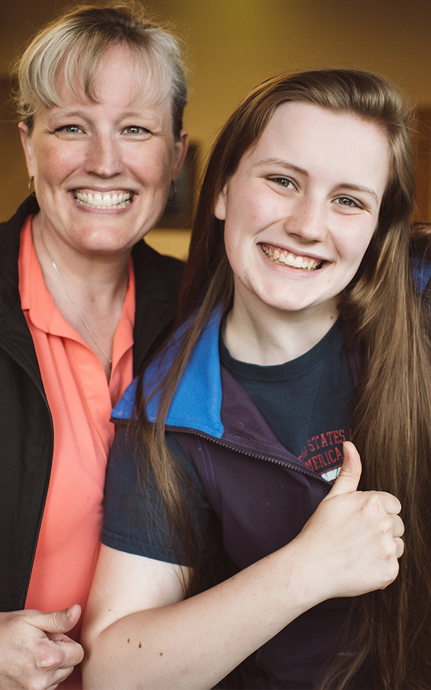 Master Orthodontics patient with thumbs up